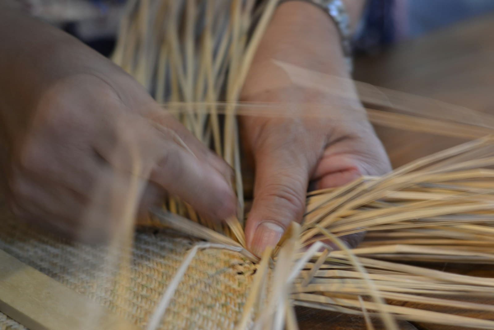 Artisan hands at work on a traditional loom