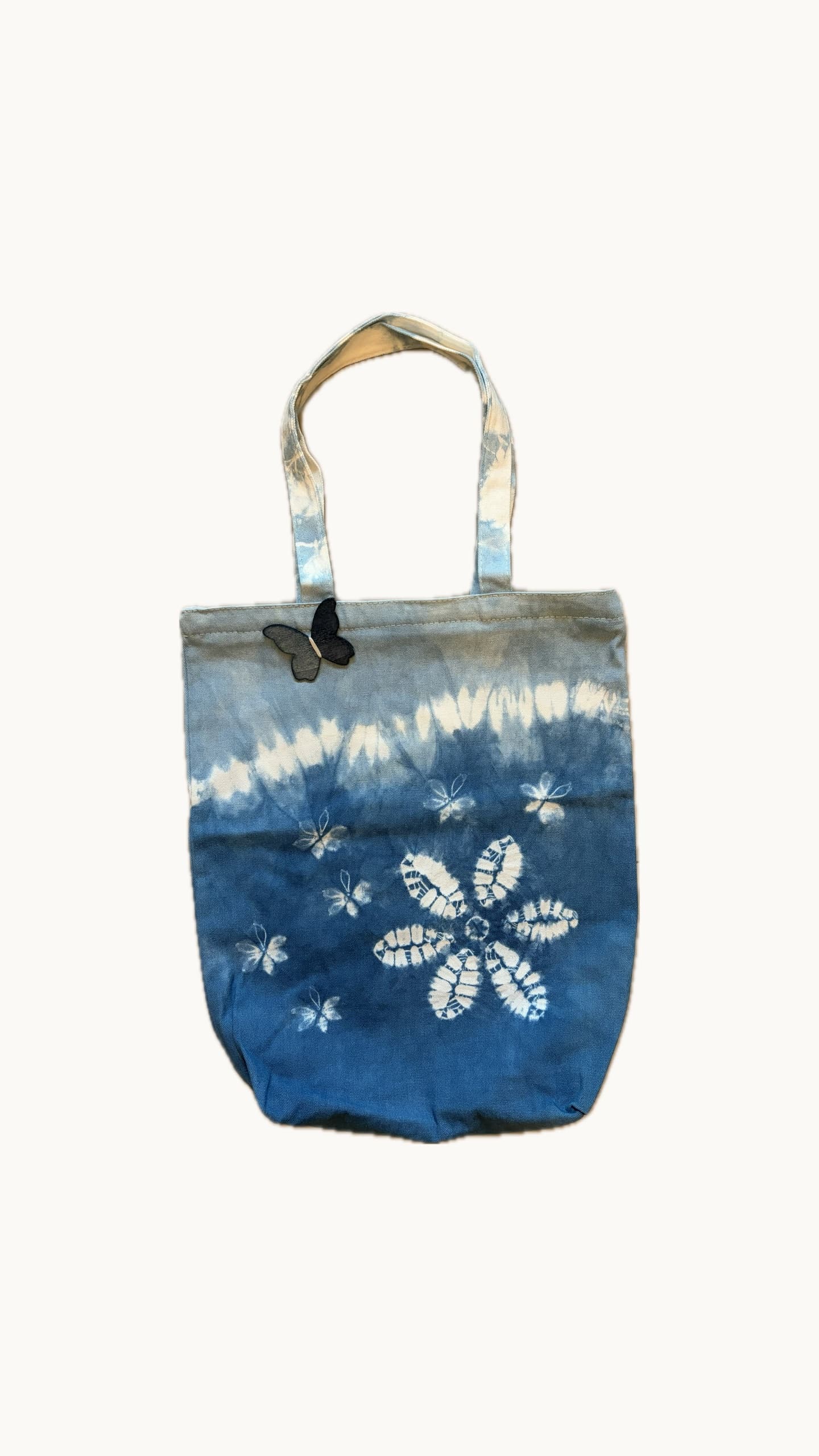 Butterfly Blossom indigo tote with floral pattern