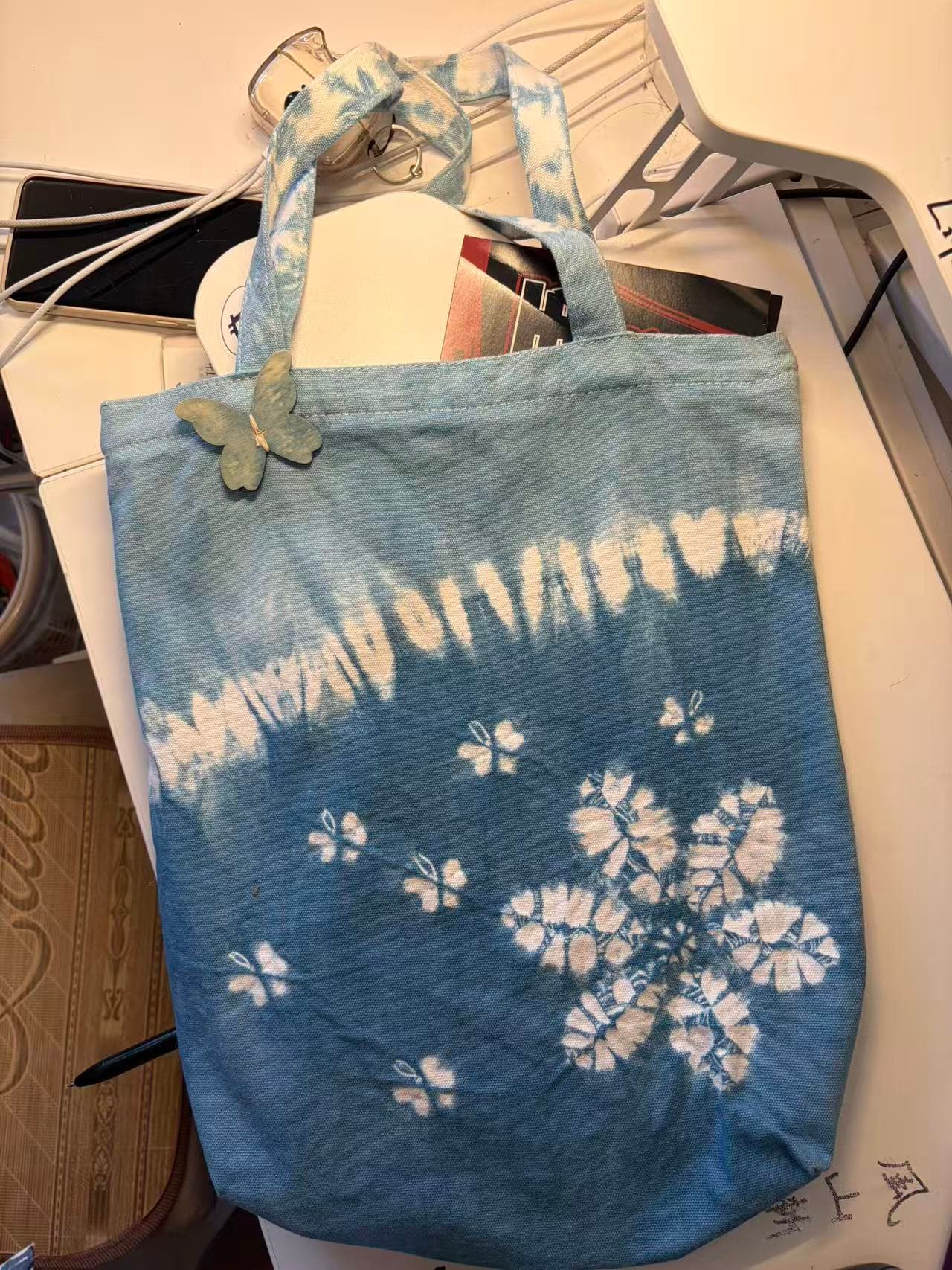 Butterfly Blossom indigo tote with floral pattern