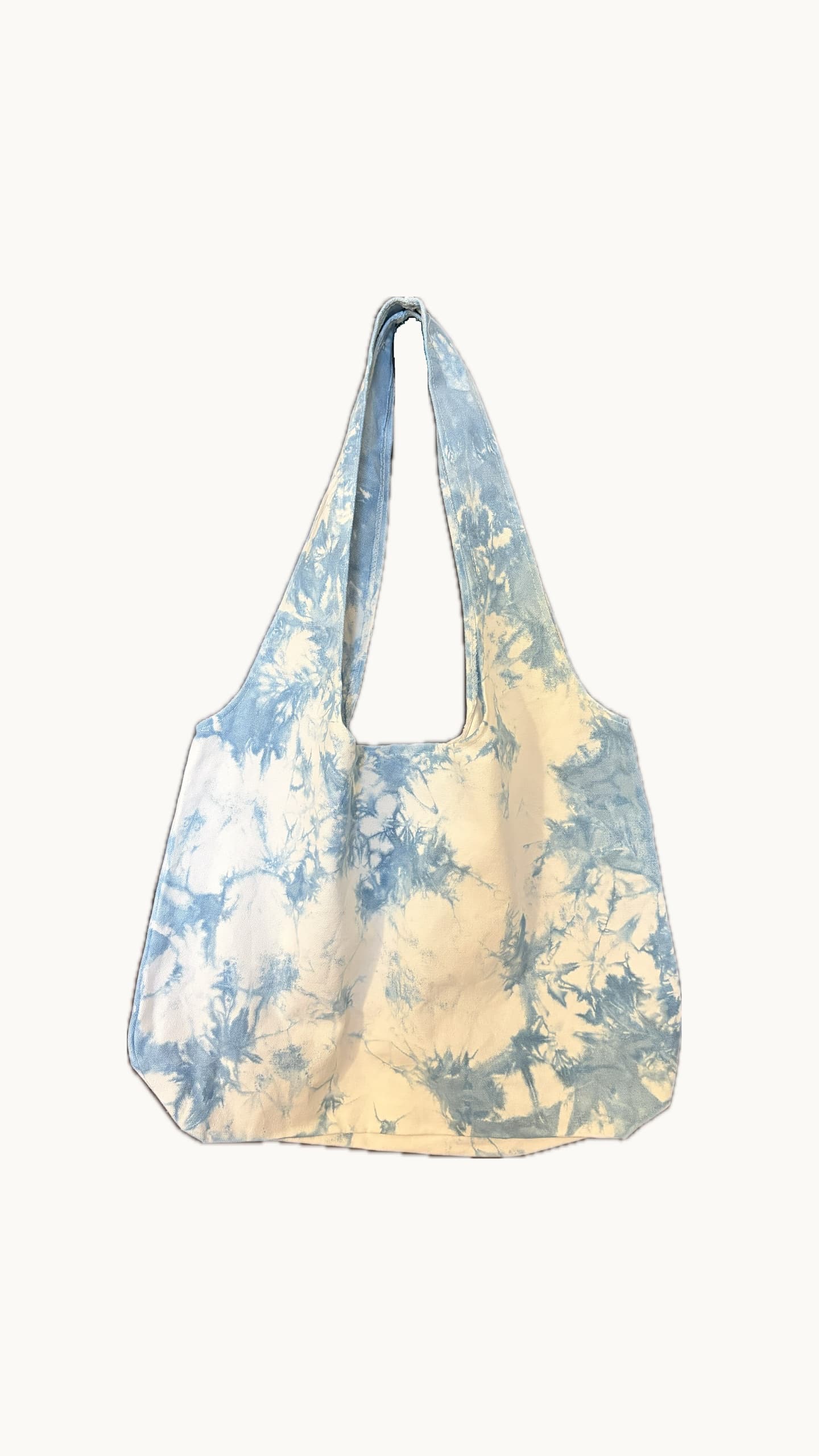 Dali marbled indigo tote hanging on workshop rack